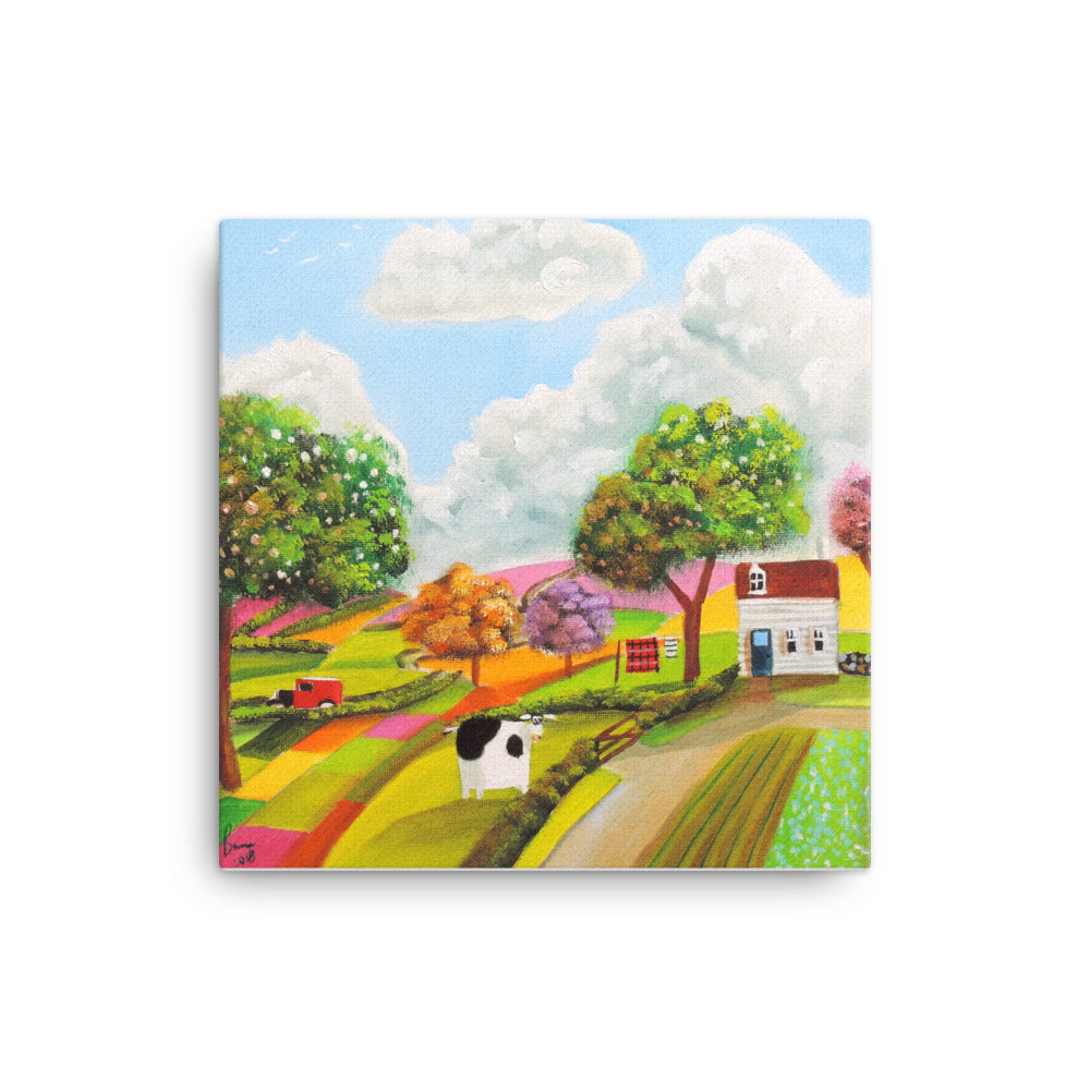 Cow in patchwork fields Canvas